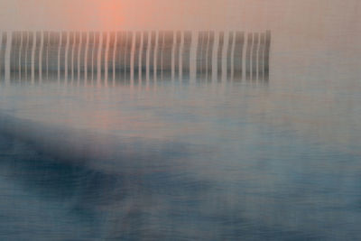 Scenic view of sea against sky at sunset