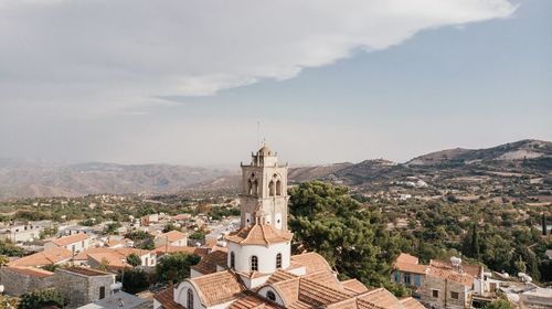 Buildings in town against sky