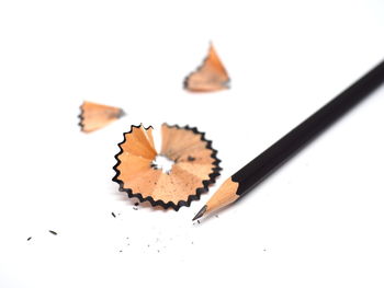 High angle view of pencils on white background