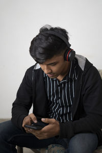 Young man using mobile phone