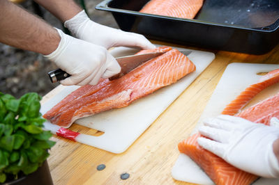 Midsection of person preparing food