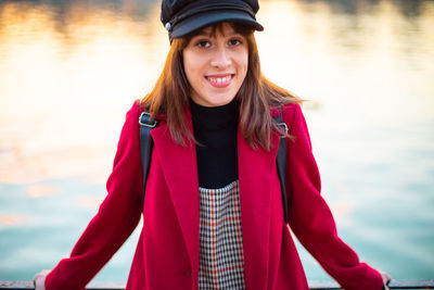 Portrait of beautiful young woman in lake