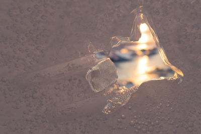 Close-up of illuminated lighting equipment on sand