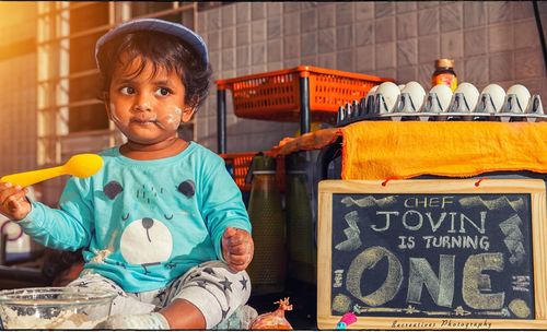 Portrait of cute boy at market stall