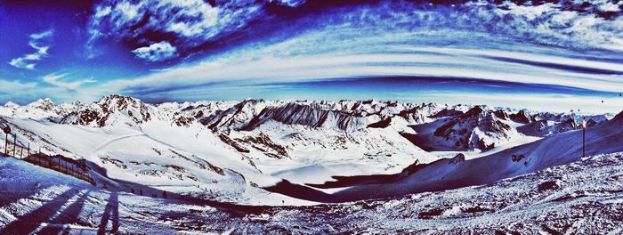Scenic view of snow covered mountains
