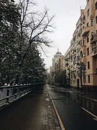 Road by city against sky