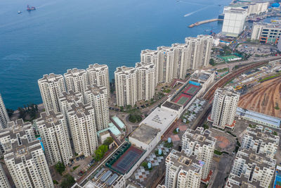 High angle view of buildings and sea in city