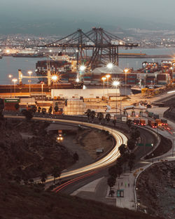 High angle view of light trails on road at night