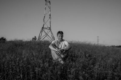 Woman standing on grassy field
