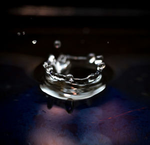 Close-up of water drop on table