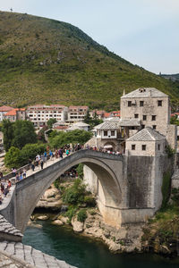 Arch bridge over river in city