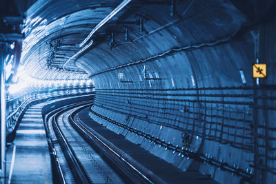 Low angle view of illuminated tunnel