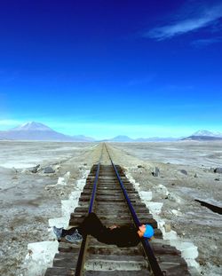 Scenic view of mountains against blue sky