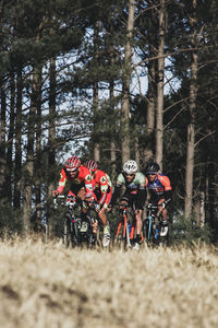 People riding bicycle in park