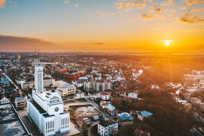 Aerial view of townscape against sky during sunrise