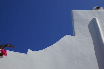 Low angle view of building against clear blue sky