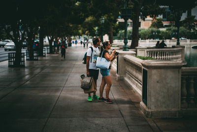 People on sidewalk in city