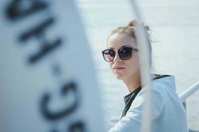Portrait of young woman wearing sunglasses