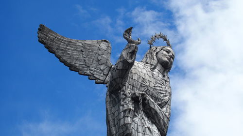 Low angle view of statue against sky