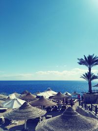 Scenic view of beach against blue sky