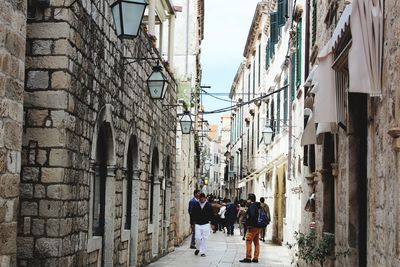 People walking in alley