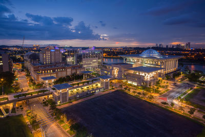 Aerial view of city lit up at night