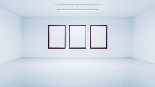 Blank frames on wall in modern room