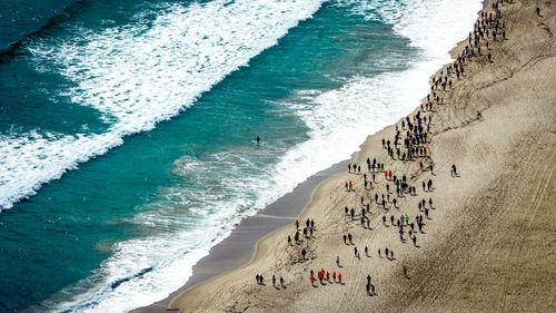 High angle view of people on beach against sky