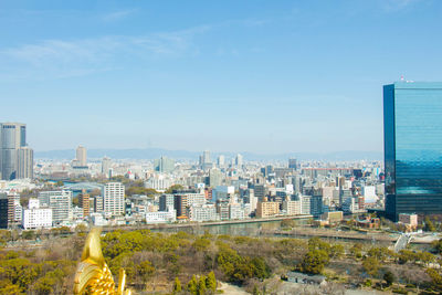 High angle view of buildings in city against sky