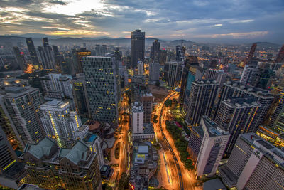 High angle view of kuala lumpu against cloudy sky at dusk