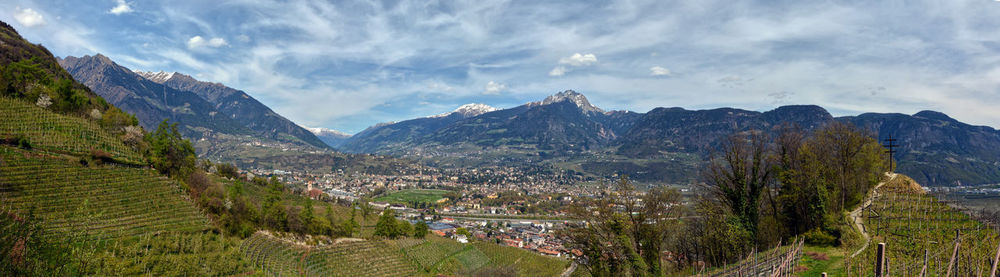 Panoramic view of agricultural landscape against sky