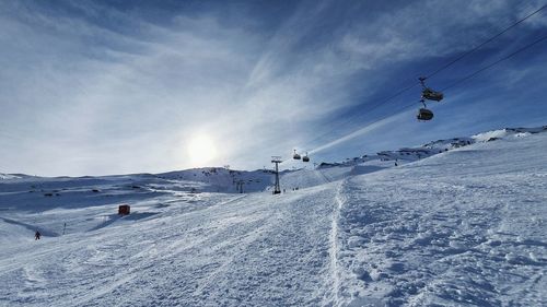 Scenic view of snow covered mountains against sky