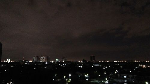 High angle view of illuminated buildings in city at night