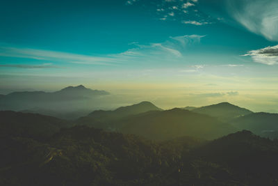 Scenic view of mountains against sky at sunset