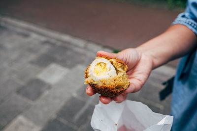 High angle view of person holding ice cream