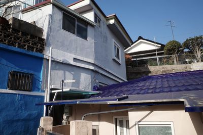 Low angle view of houses against sky
