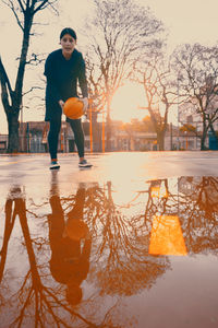 Female basketball player during rainy day