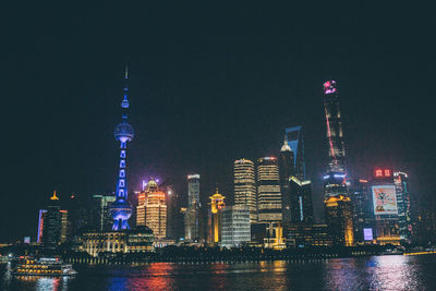 Aerial view of city lit up at night