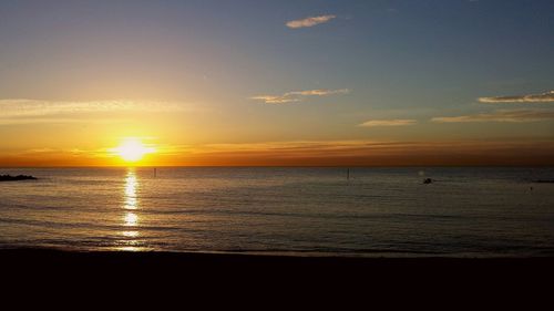 Scenic view of sea against sky at sunset