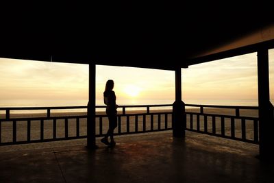 Silhouette of pier at sunset