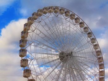 Low angle view of ferris wheel against sky