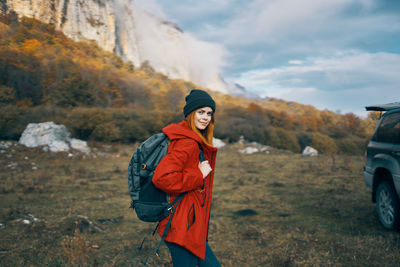 Portrait of man standing in mountains