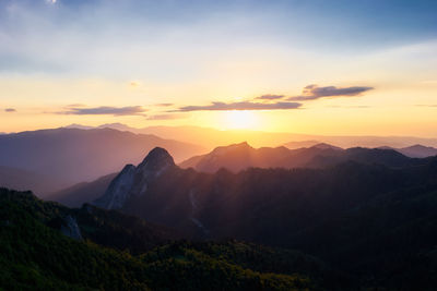 Scenic view of mountains against sky during sunset