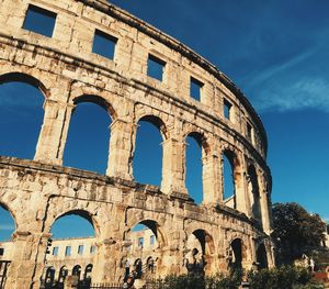 Low angle view of historical building against sky at pula