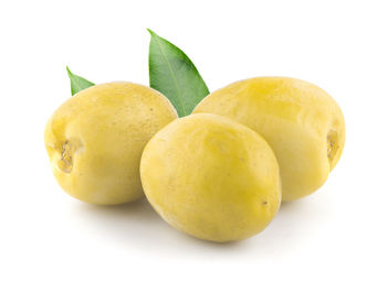 Close-up of fruits against white background