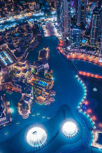 High angle view of illuminated buildings in city at night