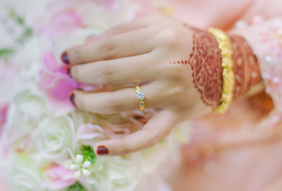Close-up of woman hand holding bouquet