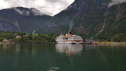 Scenic view of river with mountains in background