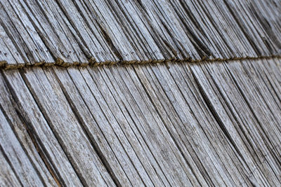 Surface of an old grey wooden roof