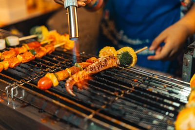 Midsection of man preparing food